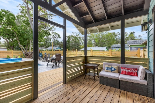 wooden terrace with fence private yard, outdoor lounge area, and outdoor dining space