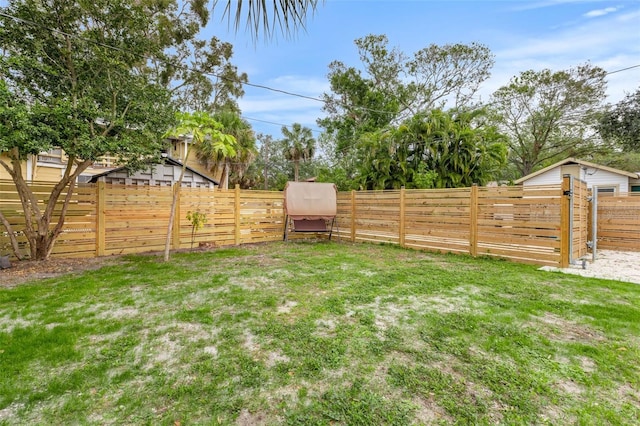 view of yard with a fenced backyard