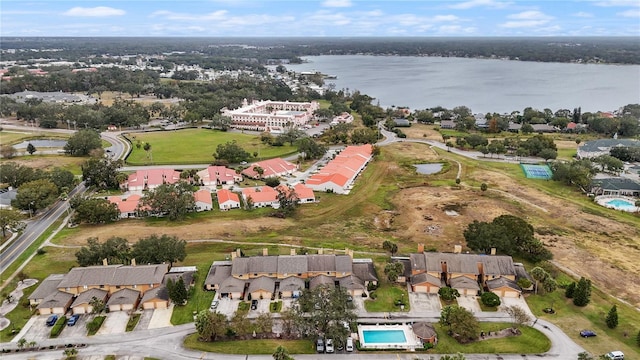 birds eye view of property with a water view