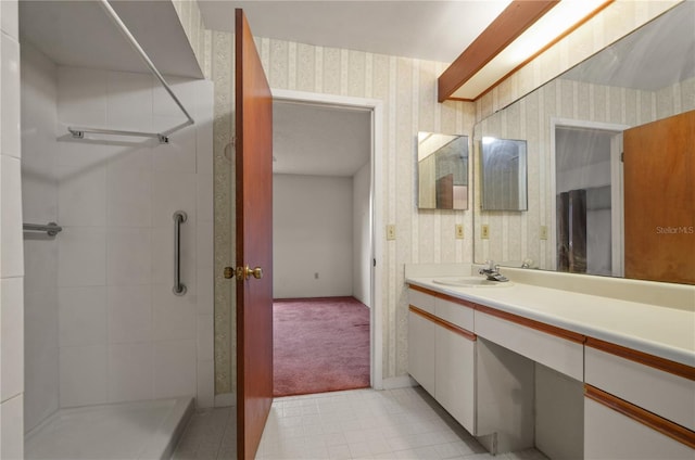 bathroom featuring vanity and a shower