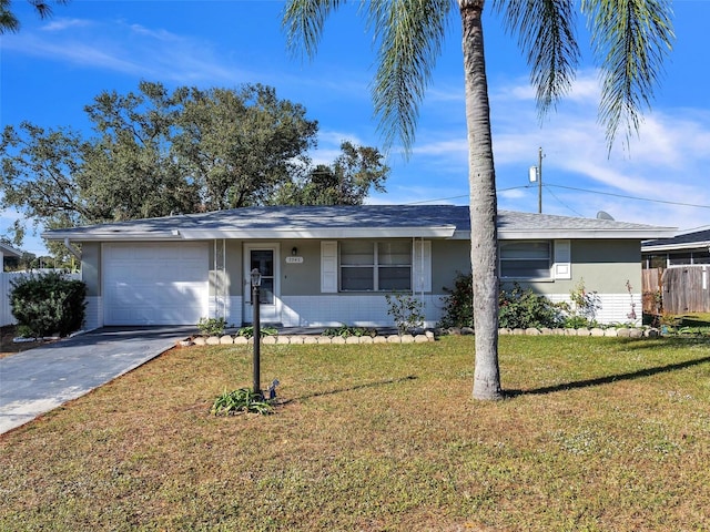 single story home with a garage and a front lawn