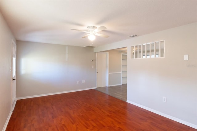 empty room featuring ceiling fan and hardwood / wood-style flooring