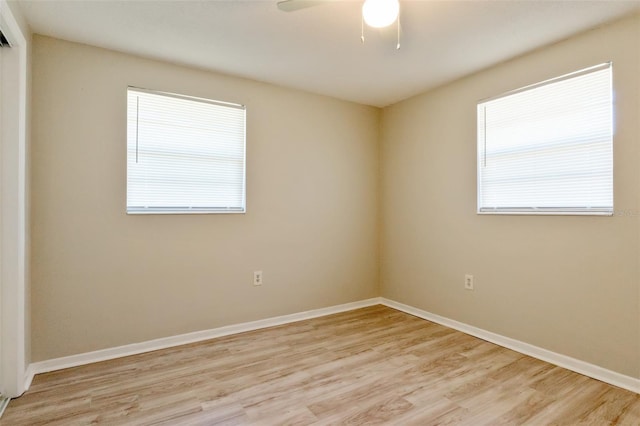 spare room with ceiling fan and light hardwood / wood-style floors