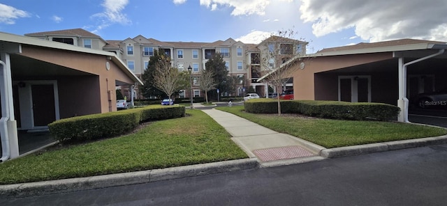 view of home's community with a yard