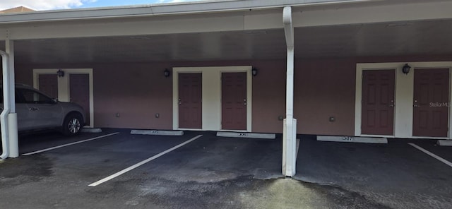 garage featuring a carport