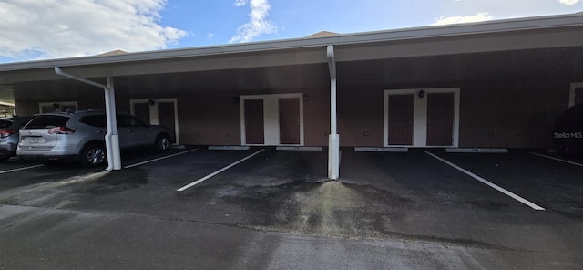 view of car parking with a carport