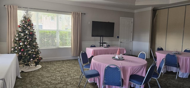 dining area featuring plenty of natural light and crown molding