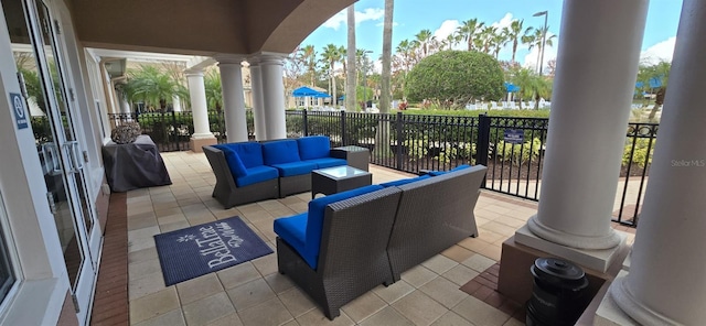 view of patio with a grill and an outdoor living space