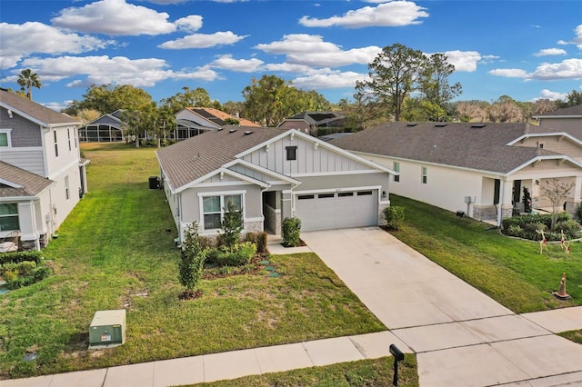 craftsman house featuring driveway, board and batten siding, an attached garage, and a front yard