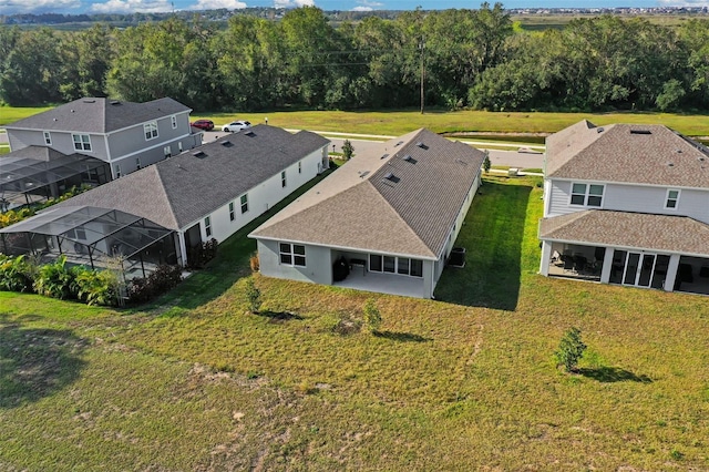 drone / aerial view with a view of trees