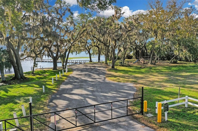 10157 Spring Lake Dr, Clermont, FL 34711 - surrounding community with a water view