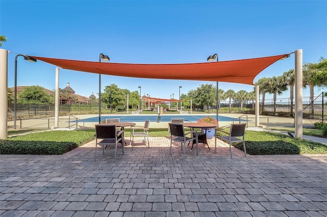 exterior space with fence and shuffleboard