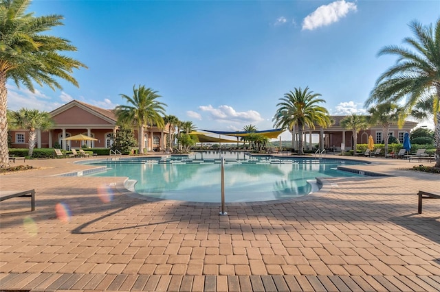 community pool with a patio area