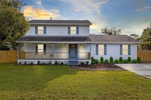 view of front of home featuring a lawn and a porch