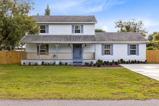 view of front facade featuring a front lawn and covered porch