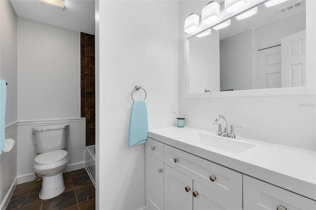 full bathroom featuring vanity, toilet, and washtub / shower combination