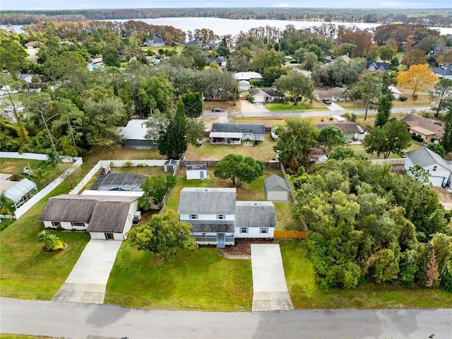 birds eye view of property featuring a water view and a residential view