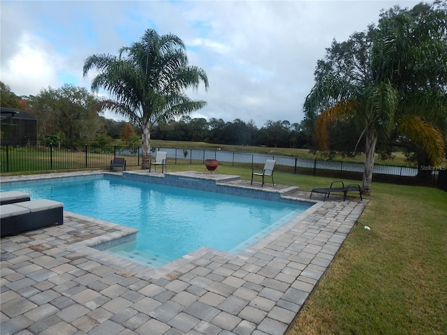 view of swimming pool with a lawn and a patio