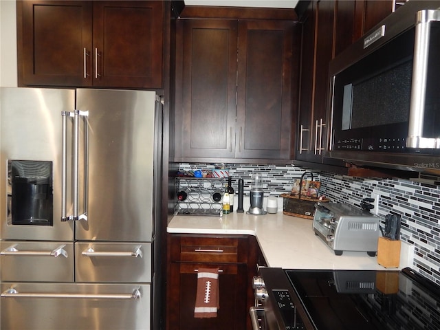 kitchen with decorative backsplash and stainless steel appliances