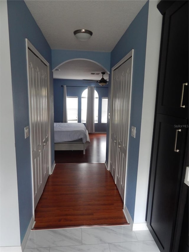 corridor featuring light hardwood / wood-style floors