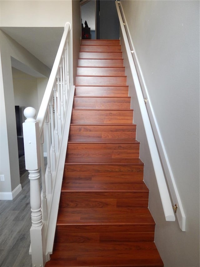 staircase featuring hardwood / wood-style floors