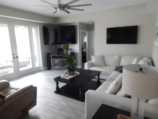 living room with ceiling fan and french doors