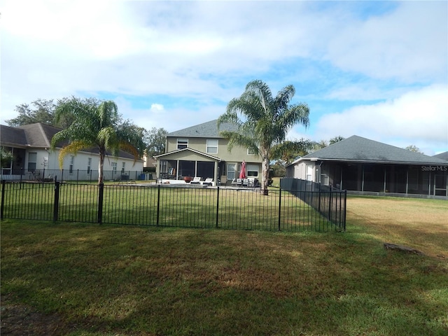 view of yard featuring a sunroom