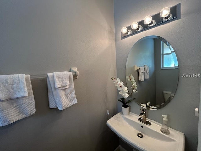 bathroom with toilet and sink