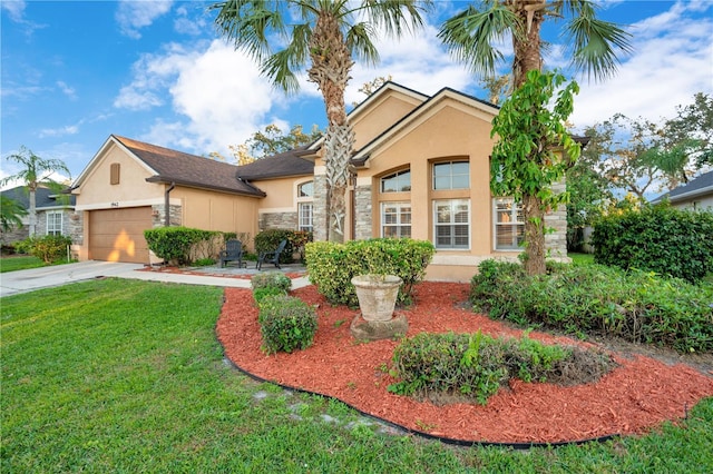 view of front facade featuring a front yard and a garage