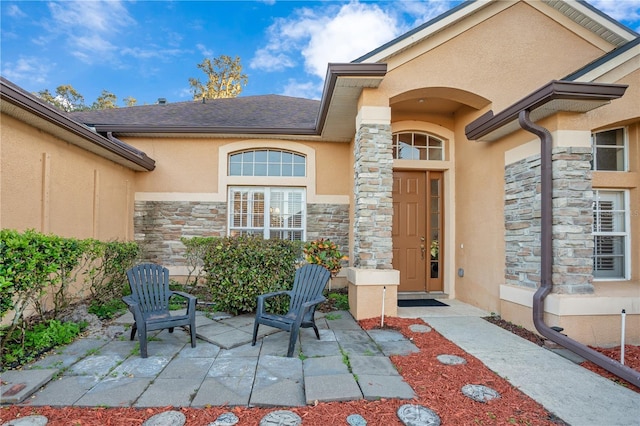 doorway to property with a patio