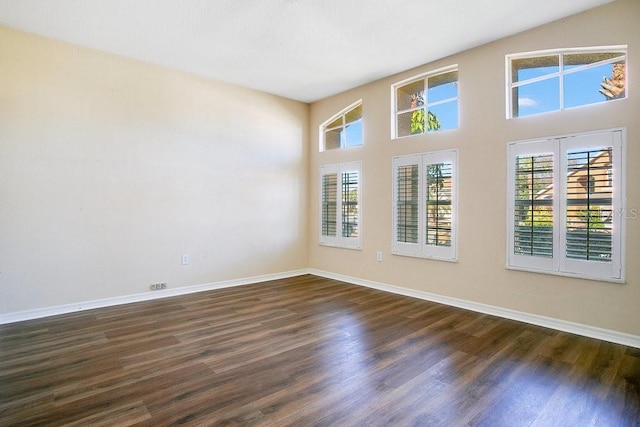 unfurnished room featuring dark hardwood / wood-style floors