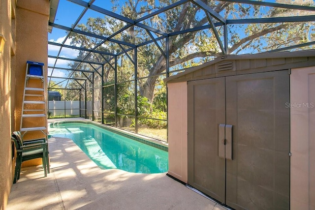 view of swimming pool with a patio and glass enclosure