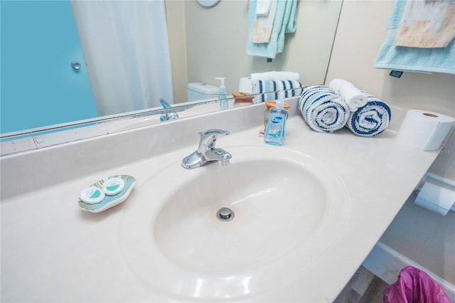 bathroom featuring sink and toilet