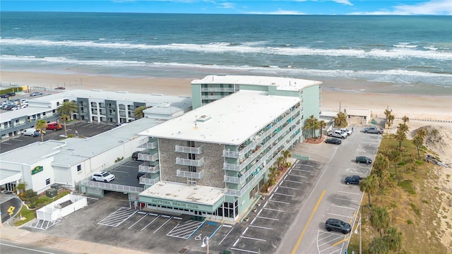 bird's eye view with a water view and a view of the beach