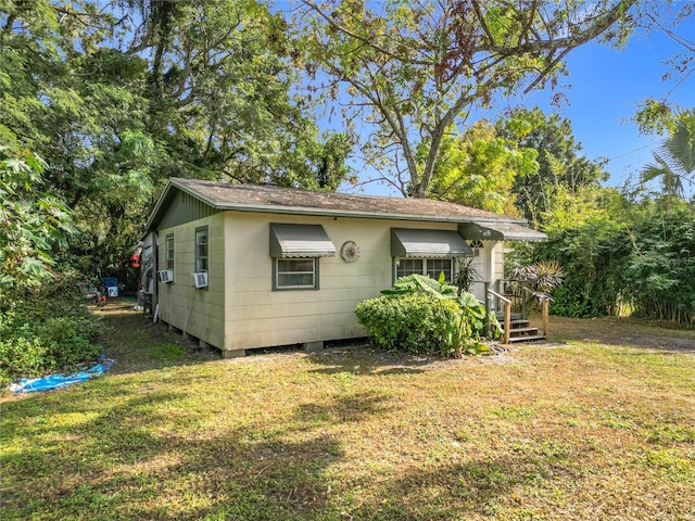 view of home's exterior with a yard