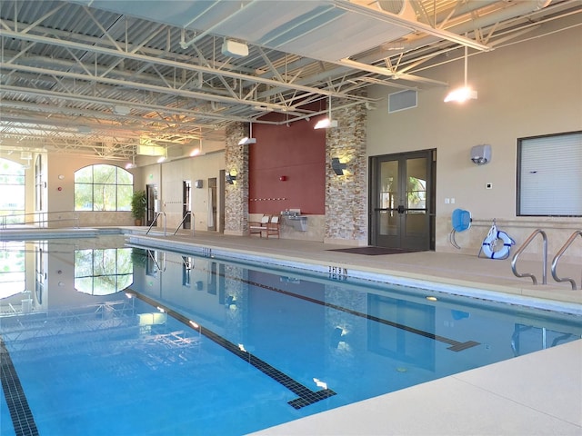 community pool featuring french doors