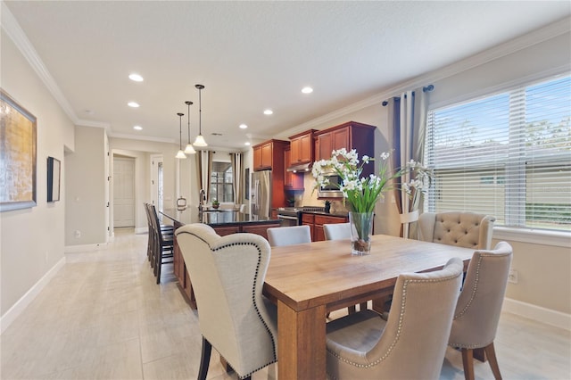 dining area featuring ornamental molding, recessed lighting, and baseboards