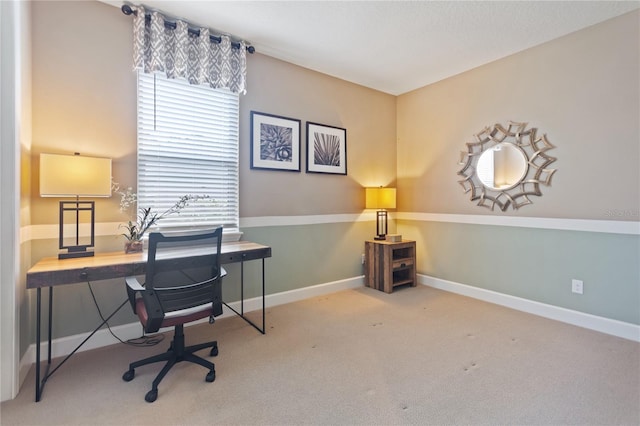 office featuring light carpet and baseboards