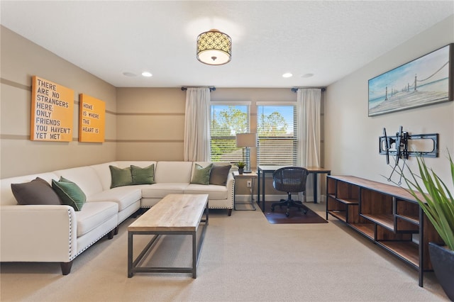 living room featuring carpet floors, recessed lighting, and a textured ceiling