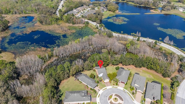 drone / aerial view featuring a water view and a residential view