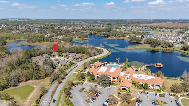 drone / aerial view with a water view and a residential view