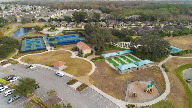 aerial view with a residential view and a water view