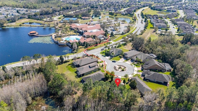 birds eye view of property with a residential view and a water view