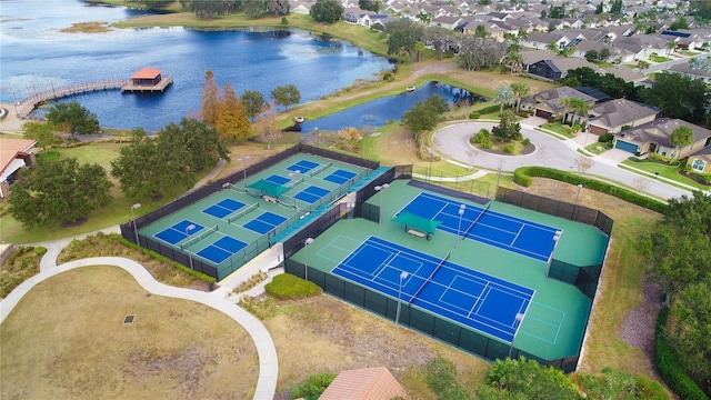 birds eye view of property with a residential view and a water view