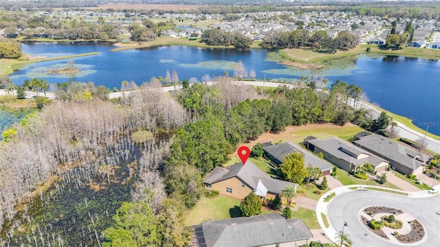 birds eye view of property with a residential view and a water view