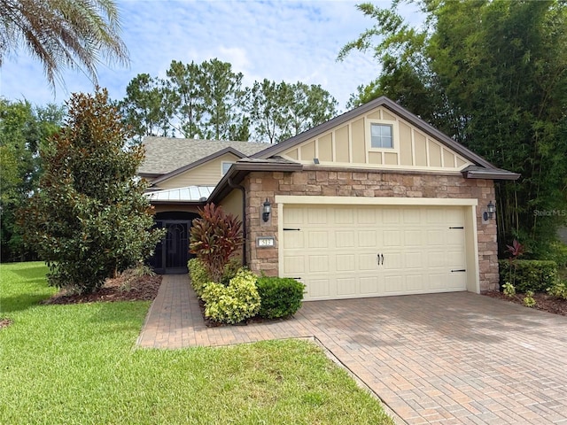 513 San Sebastian Ct, Davenport, FL 33837 - view of front of property with stone siding, a front yard, board and batten siding, roof with shingles, and decorative driveway