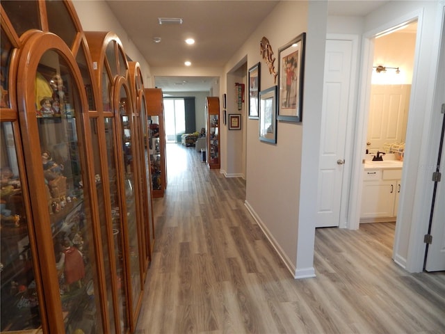 hallway with wood-type flooring