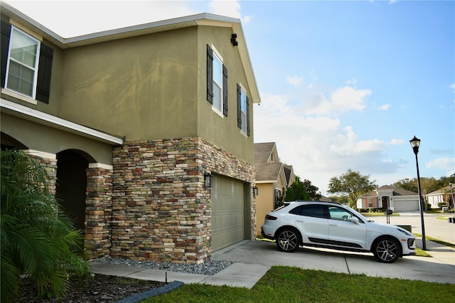 view of side of property featuring a garage