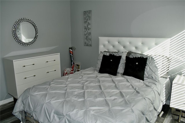 bedroom with hardwood / wood-style floors