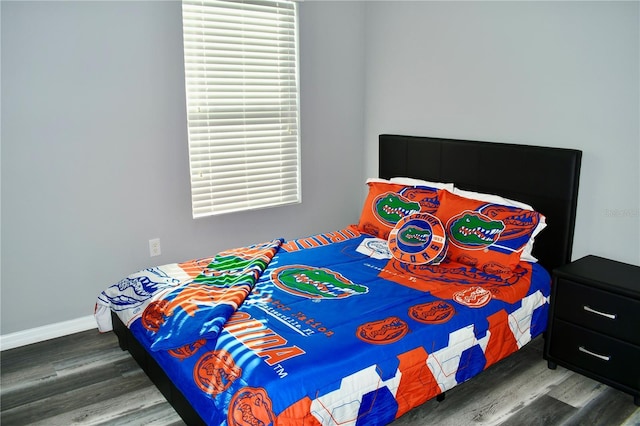 bedroom featuring dark hardwood / wood-style flooring